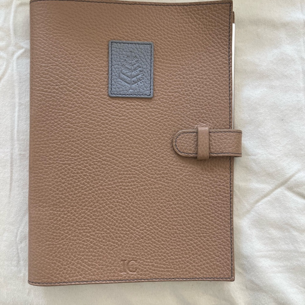 Leather notebook with a pen